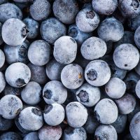 Frozen blueberry fruits, close up Frozen blueberry fruits, close up, top view, full frame.