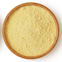 Chickpeas and chickpea flour in wooden bowl on white background Chickpeas and chickpea flour in wooden bowl on white background